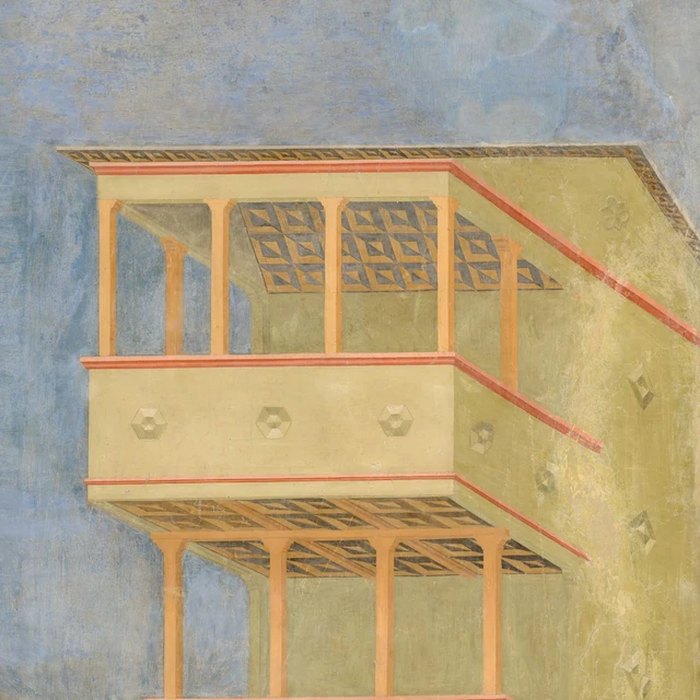 A projecting wooden gallery supported by beams and sheltered by a roof.