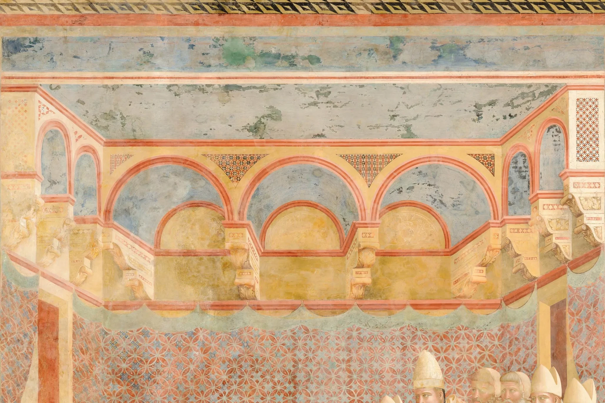 Three arches and the patterned wall covering of the room in the Confirmation of the Rule.