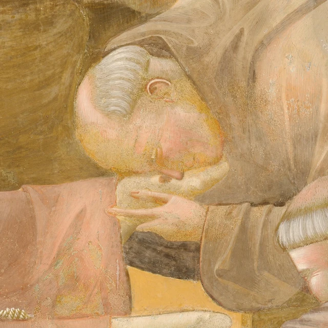 A friar bends over Francis’s foot, holding it close to his face in the Death of Saint Francis.